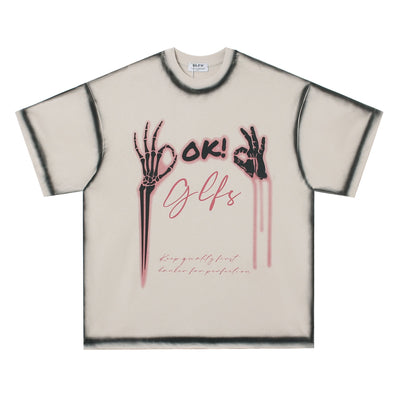 Oversized skull graphic streetwear tee in black or apricot