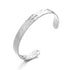 Elegant silver-tone cuff bracelet jewelry detail